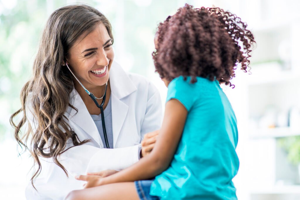 Nurse working with a young patient