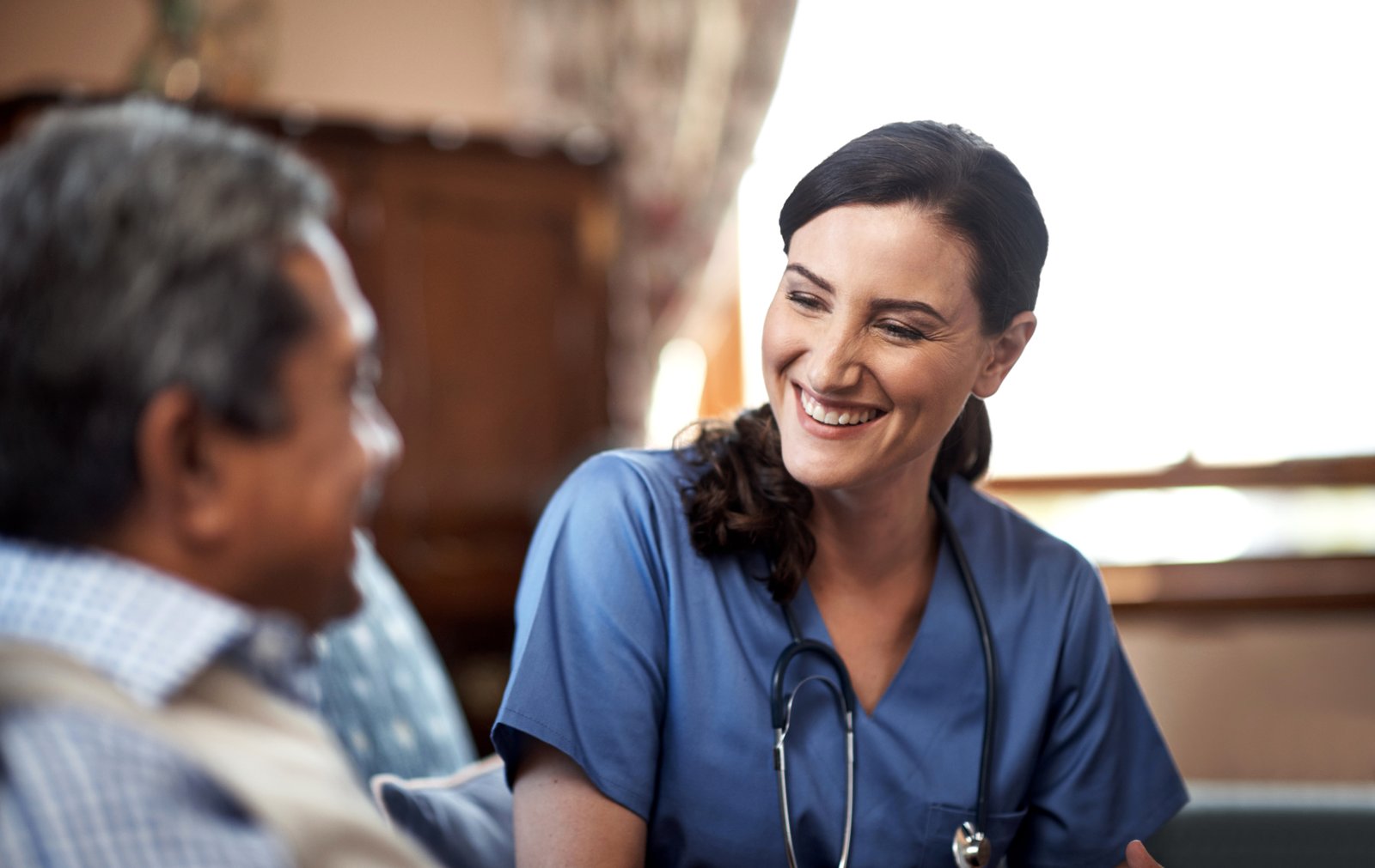 Nurse communicating with a patient