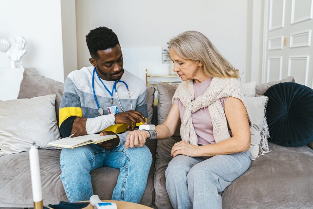 A RN visiting an AFC patient at home